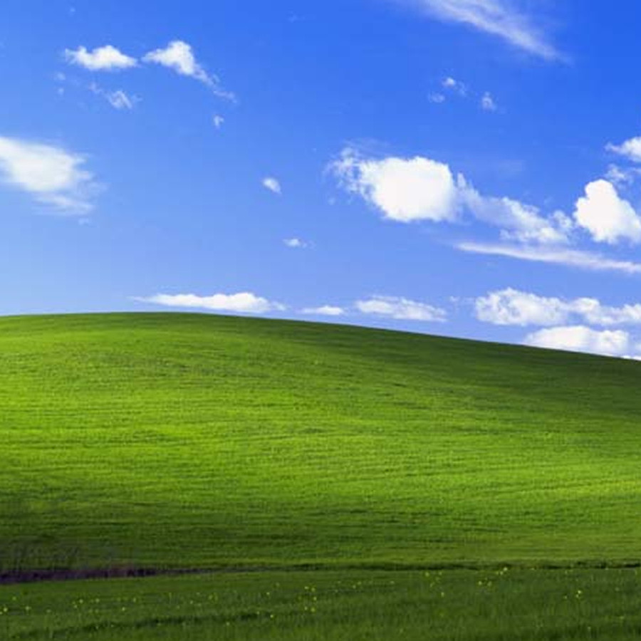 Какое бедствие сделало возможным появление пейзажа на фоне рабочего стола Windows XP?